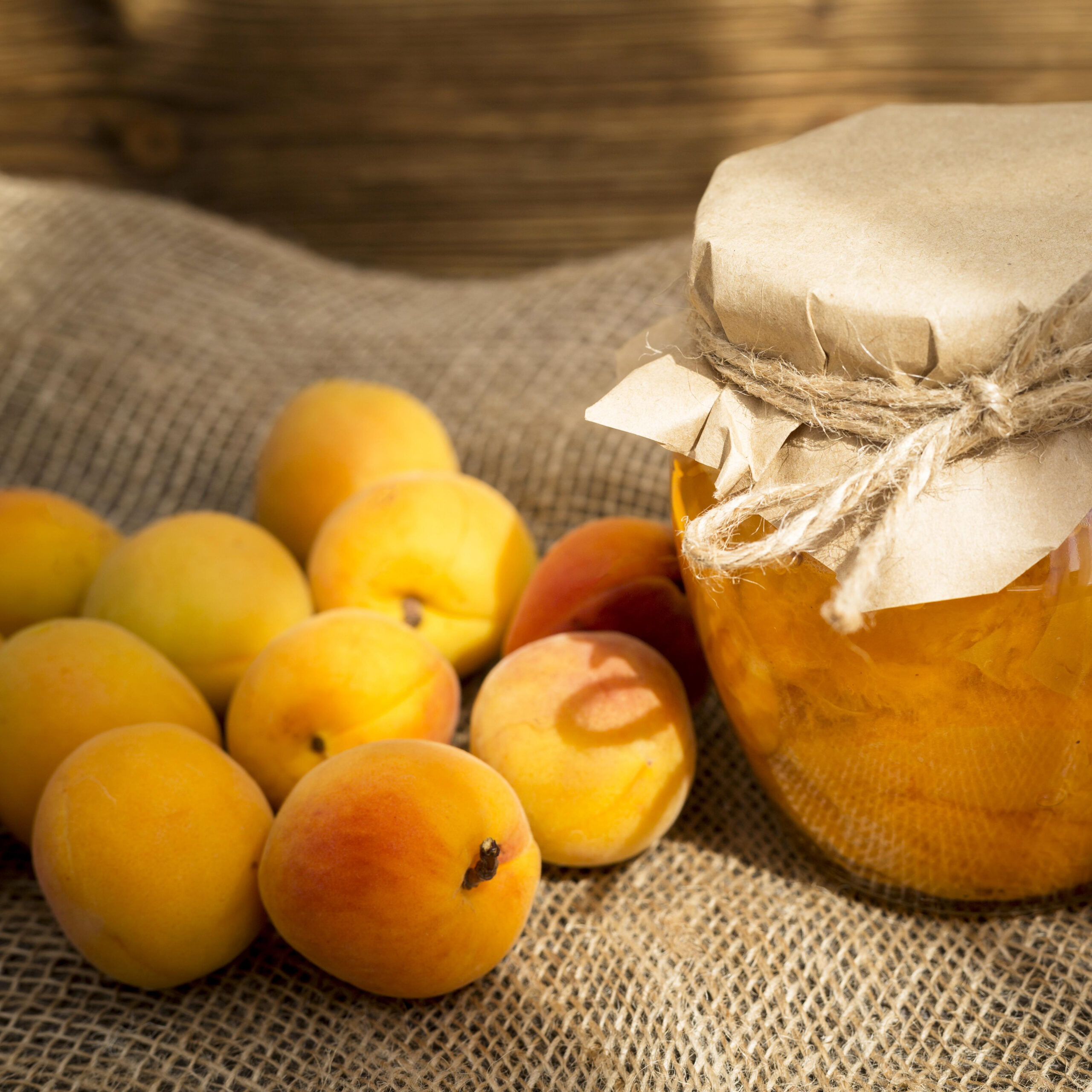 arrangement-apricots-cloth-with-jar-compote